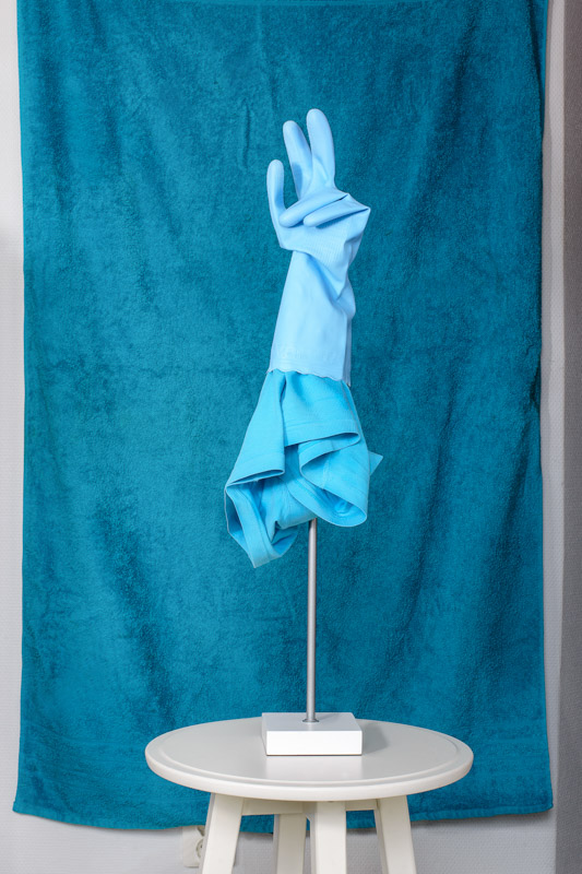 contemporary sculpture made of blue glove, blue underwear in front a blue towel. artist Stefano Conti